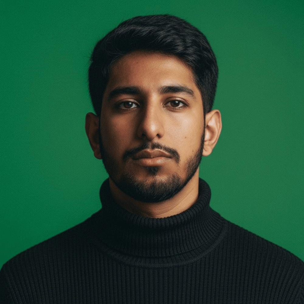 Image of a man with freckles on his face, smiling warmly, showcasing his unique features
